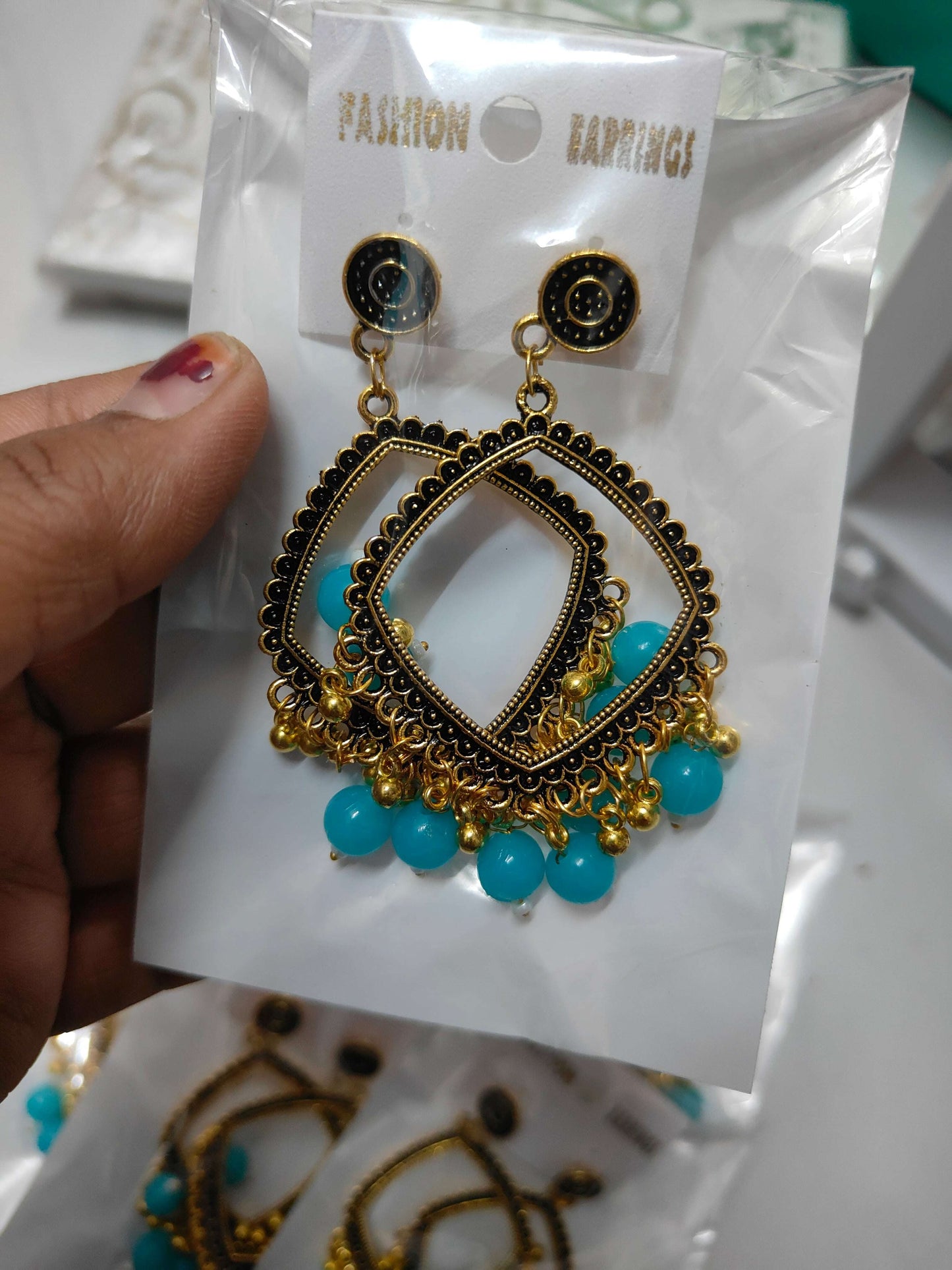 Golden square jhumka with beads, gold and black with teal bead tassel and stud tops