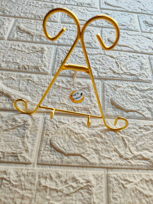 Golden designer metal stand, gold finish, two top hooks and three pegs