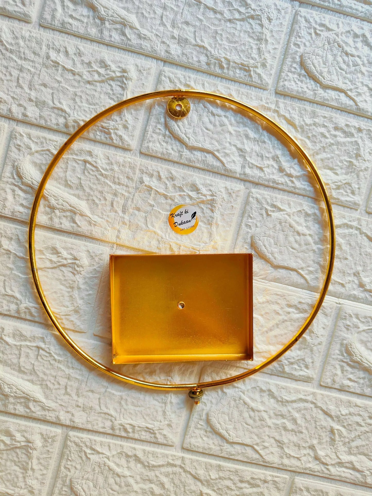 Golden loop stand: round gold ring with top finial and central square panel