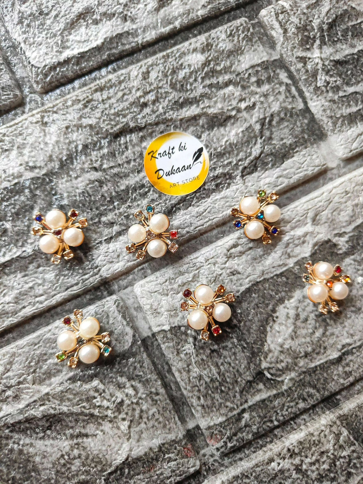 golden-pearl-flower-beads-pack-laying-on-surface