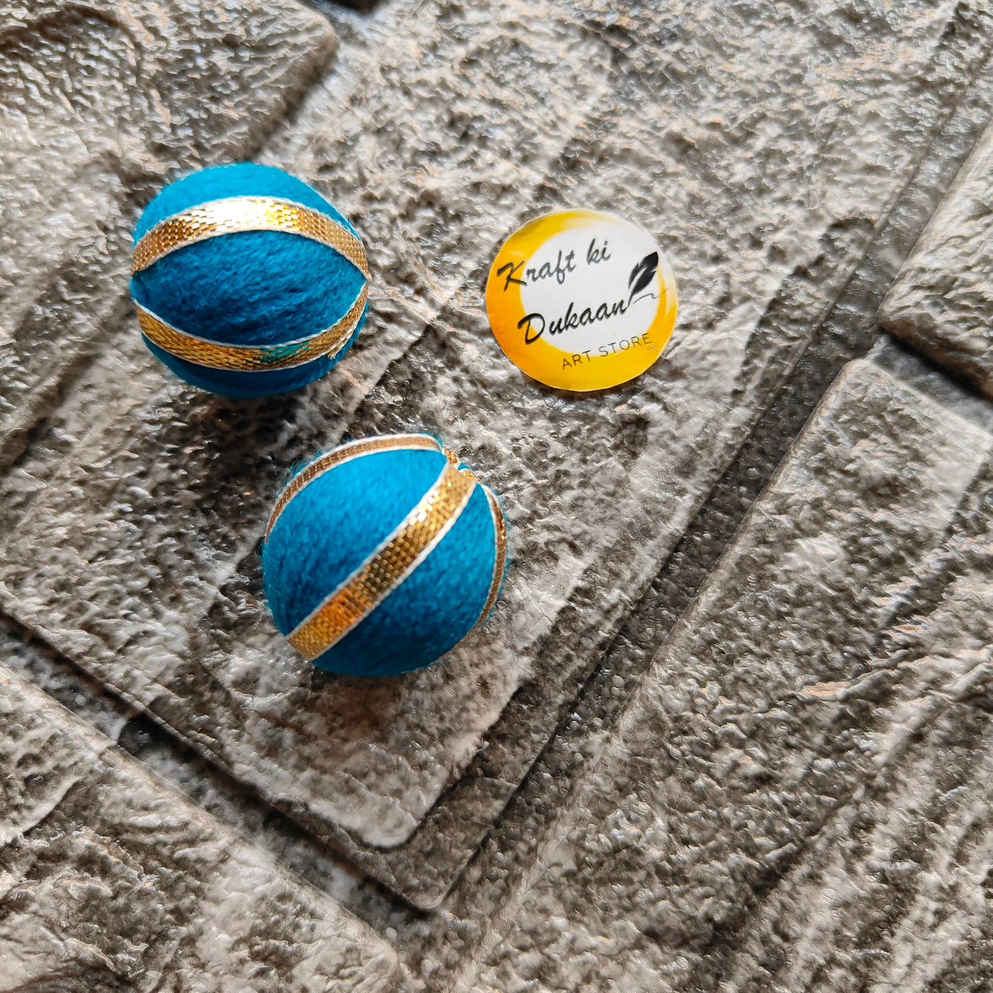 Blue Gota Patti craft balls with gold accents for decorative use in projects