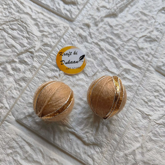 Gota Patti Balls pack: beige/cream balls with gold stripes, 2-piece view.