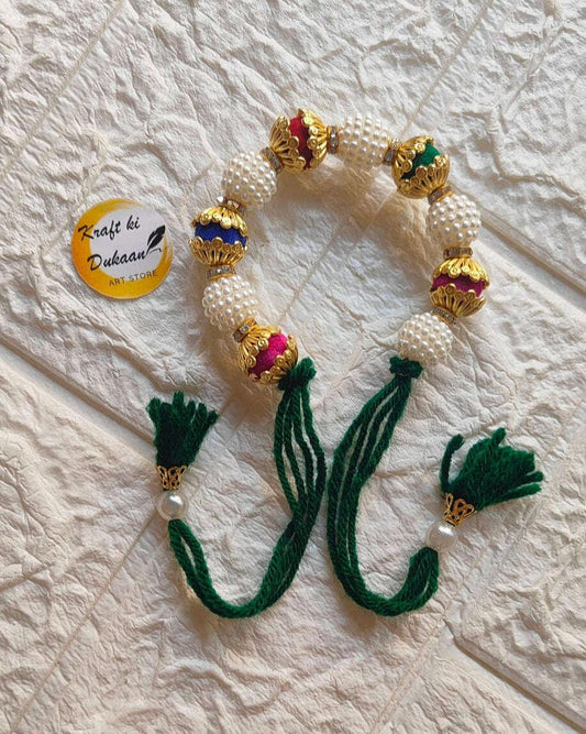handmade-beaded-bracelet-gold-pearls-green-tassels