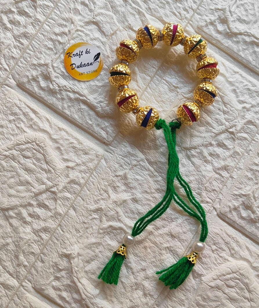 handmade-resin-bracelet-gold-and-green-tassels
