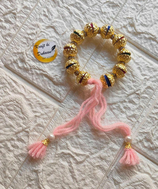 handmade-resin-bracelet-gold-and-pink-tassels