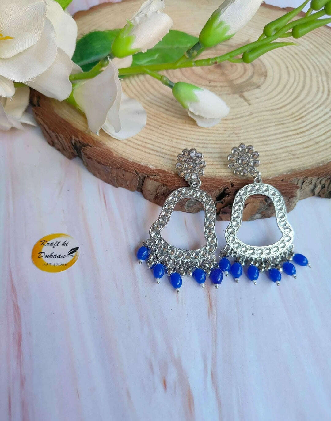 Jhumka drop earrings with silver-toned hoops and blue bead fringe