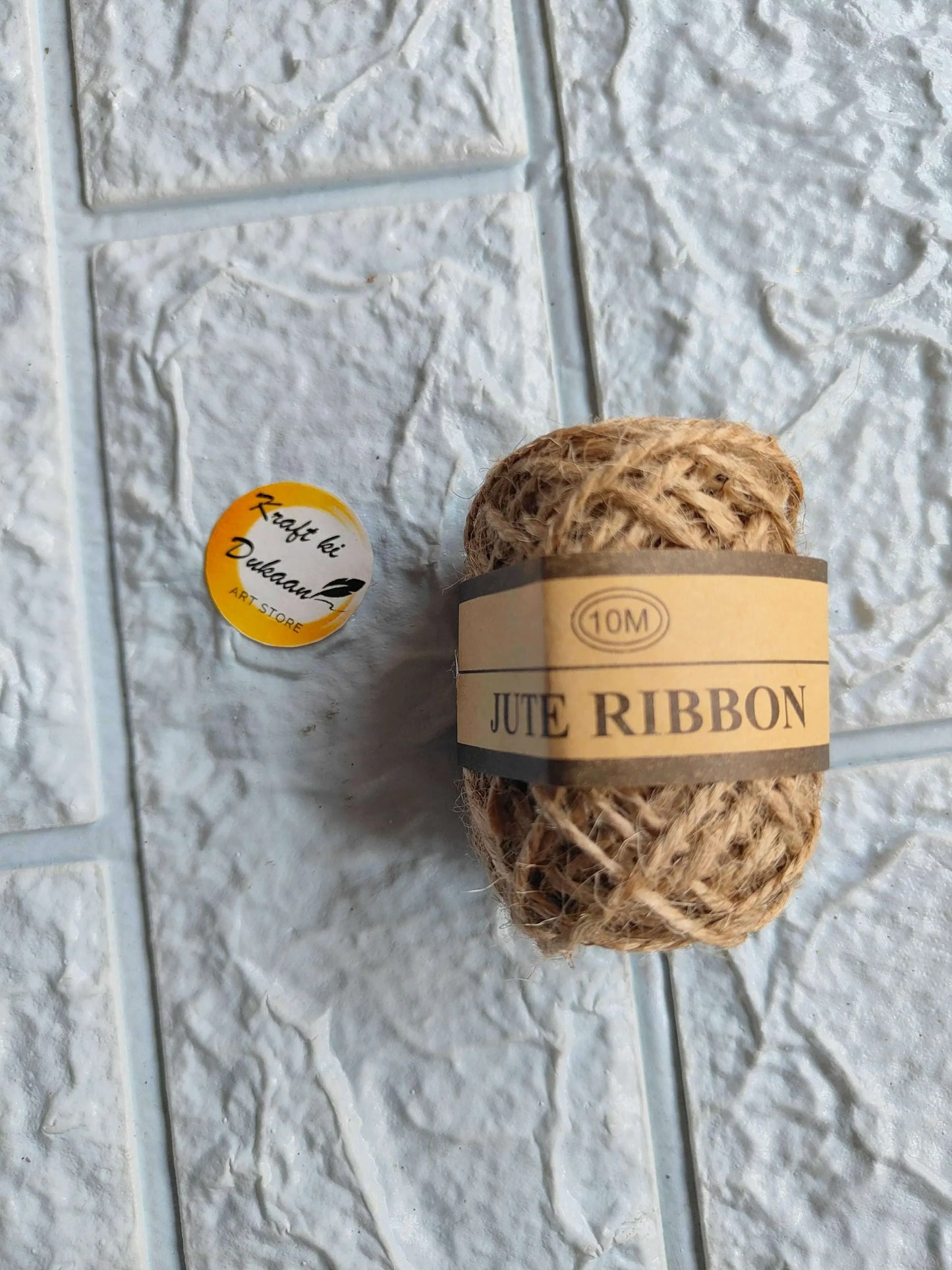 Plain jute thread roll, 10 m, natural brown, bundled with kraft label