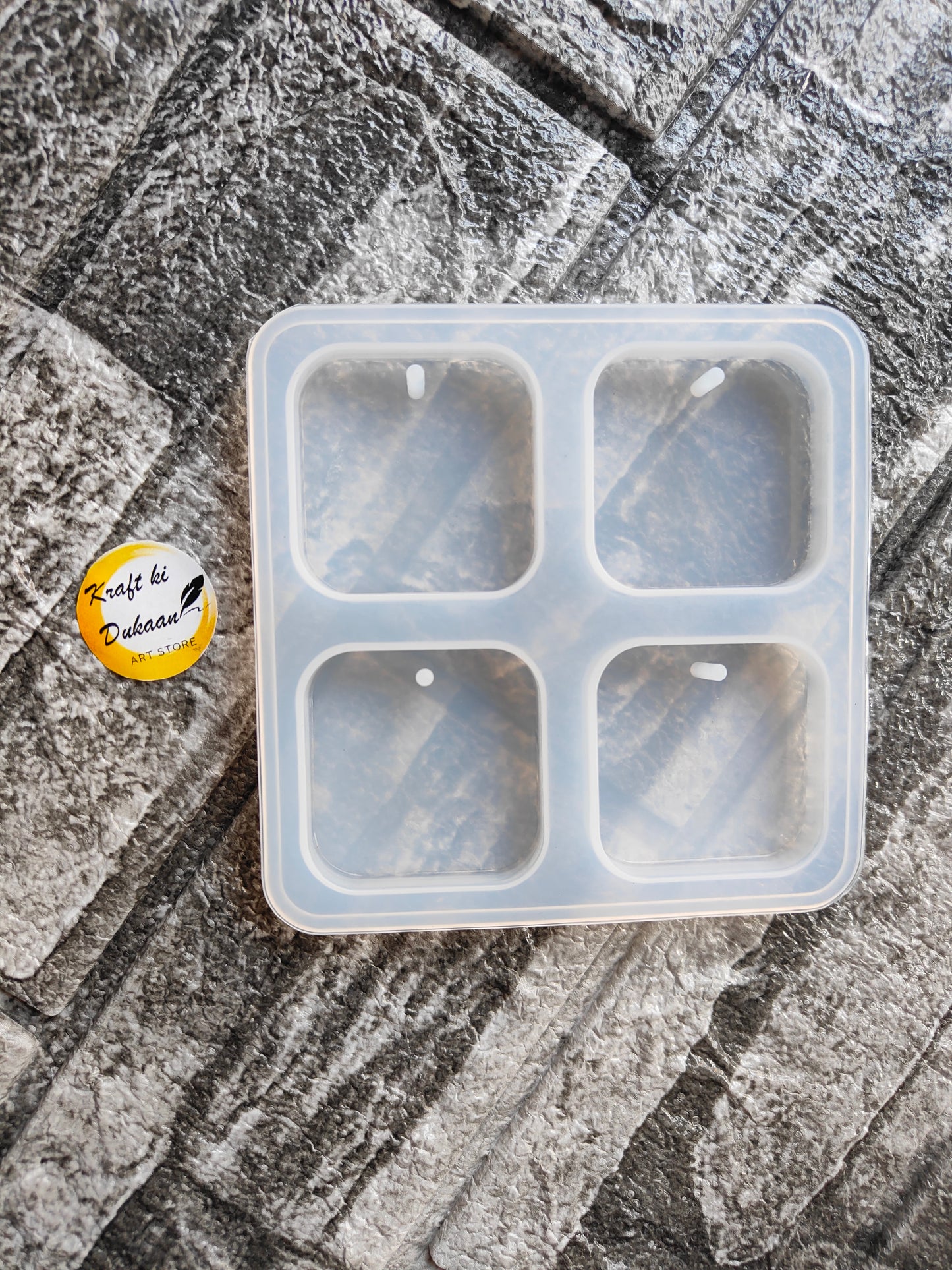 Square keychain mould for resin with four compartments for creating custom keychains