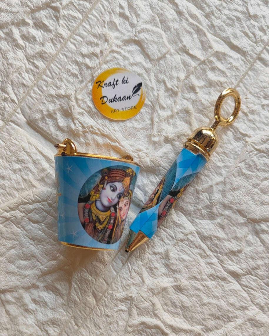 Blue printed bucket with Krishna-Radha art and gold handle; blue pichkari with cone tip