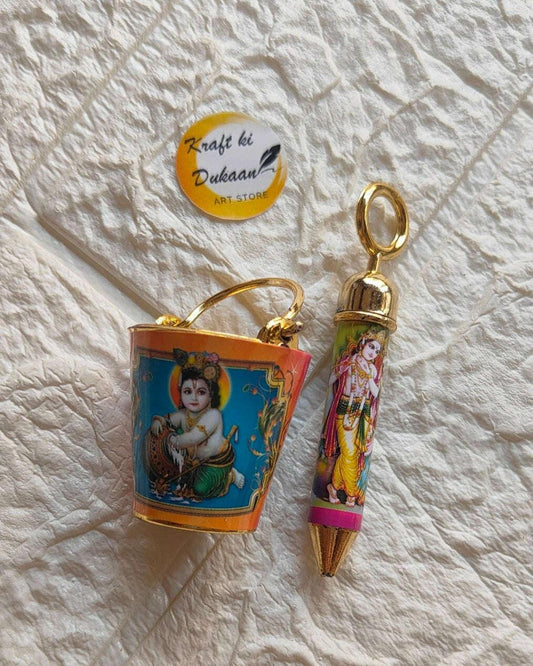Orange-and-blue printed bucket with Krishna art and gold handle; pichkari keychain