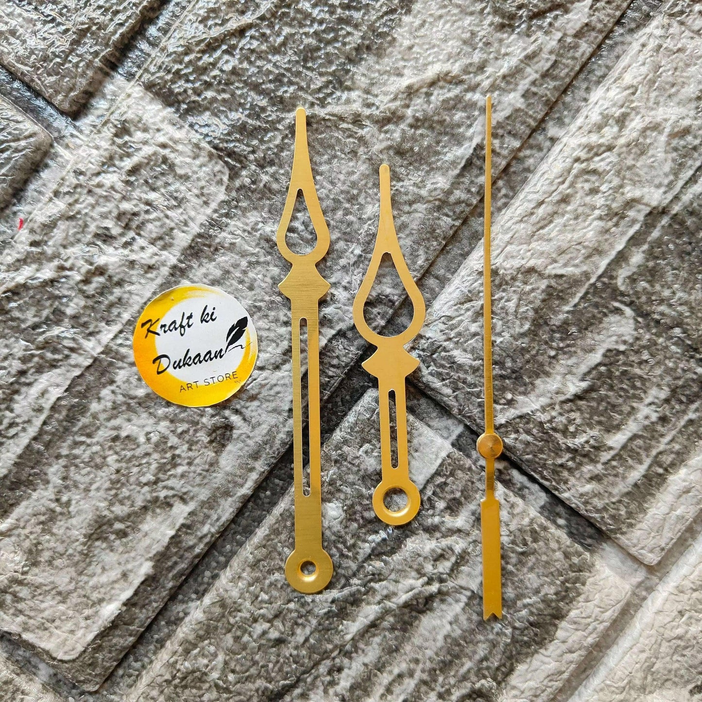 Gold metal clock hands set with long thin second hand and decorative hour/minute hands