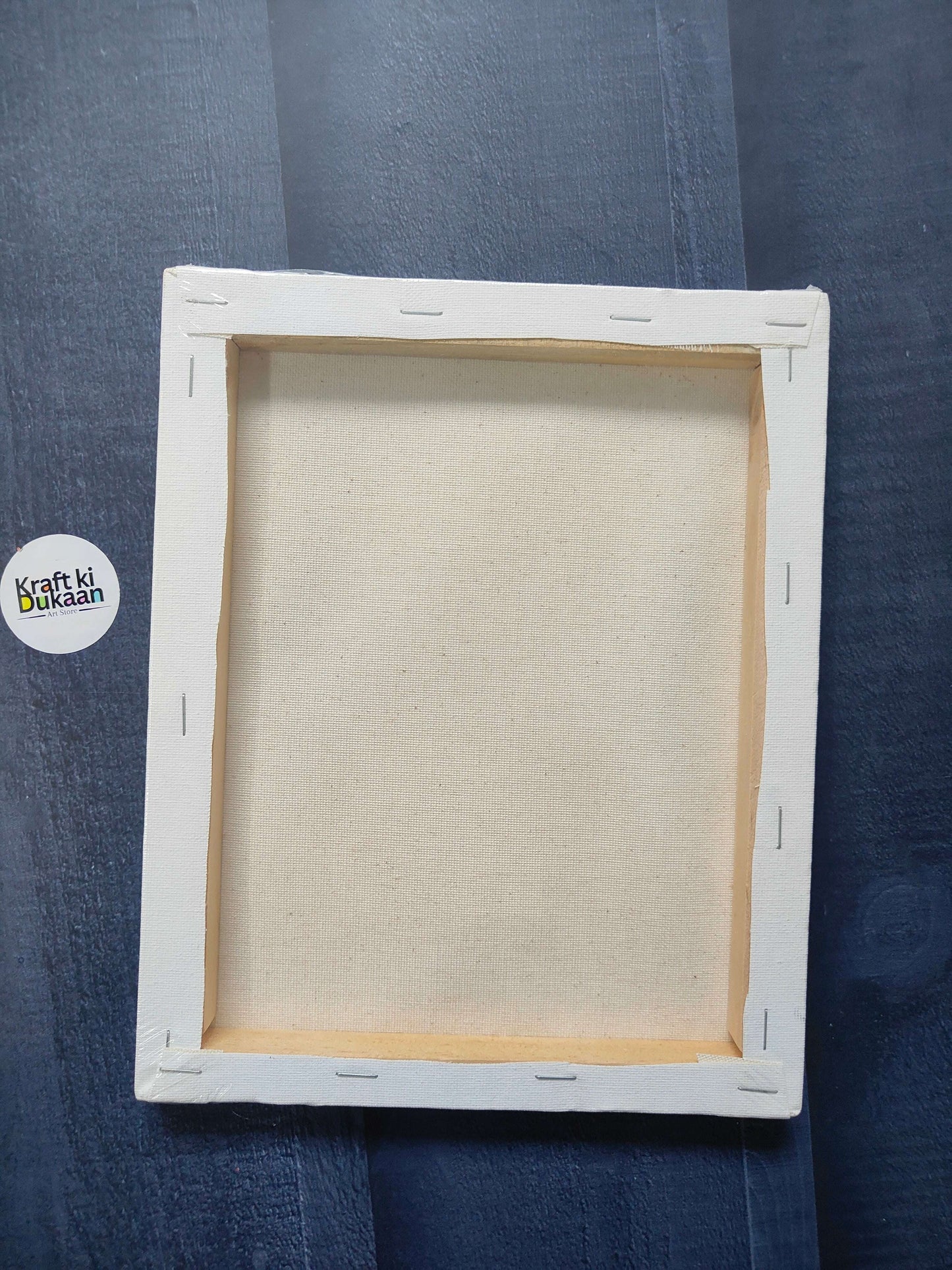 Rectangle stretched canvas board with white frame, inner wooden stretcher visible, back view