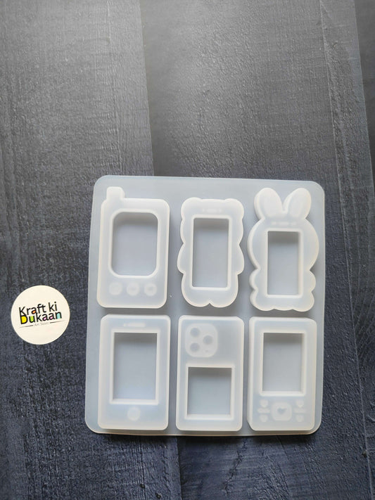 Mobile phone mould with six handset case cavity shapes in white silicone tray