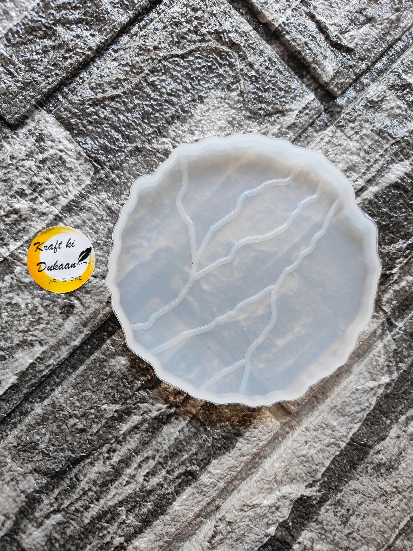 4 inch agate coaster mold for resin by Kraft ki Dukaan with detailed veining design on textured surface
