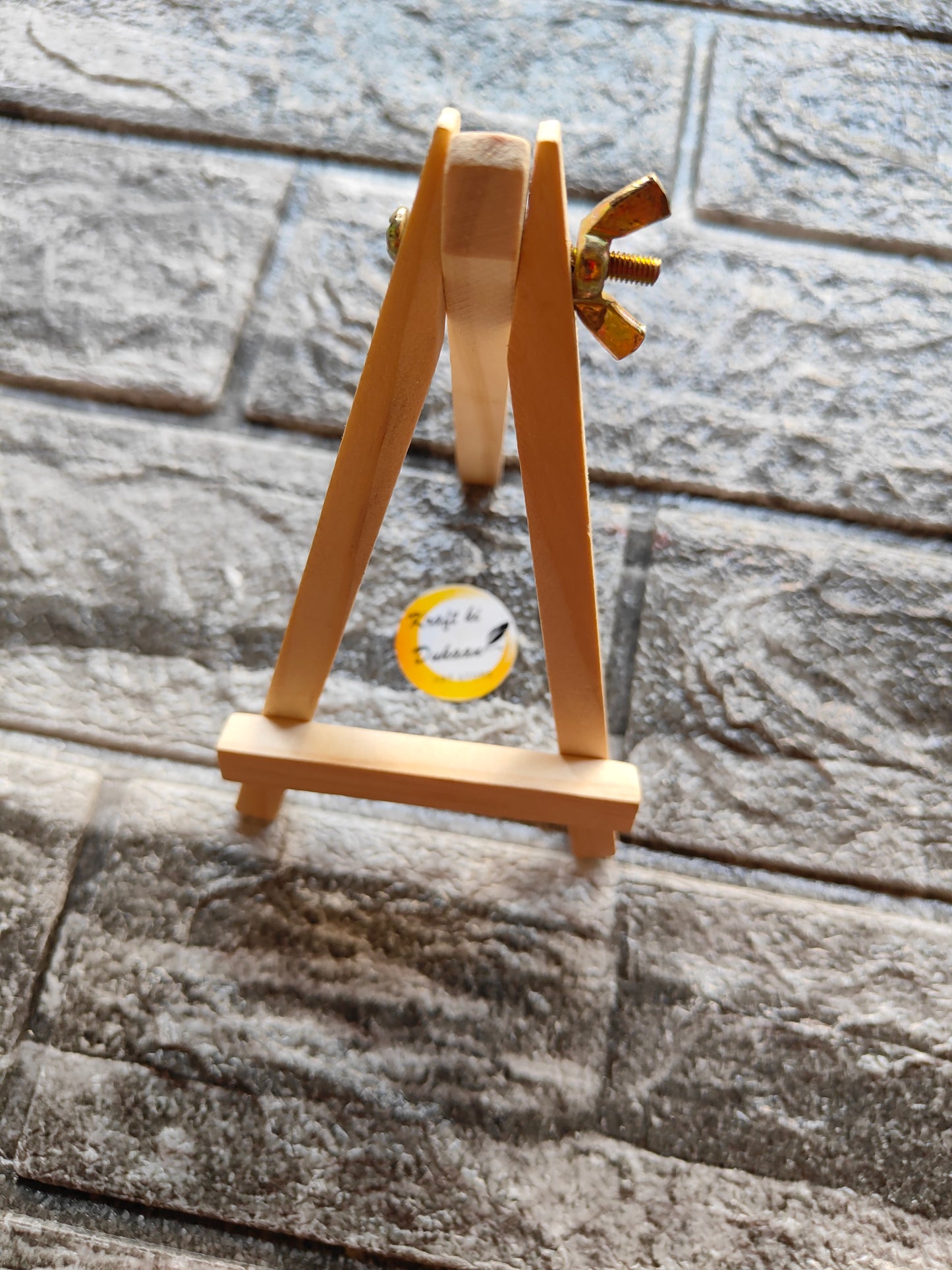 5 inch wooden easel for crafts by Kraft ki Dukaan displayed on textured stone surface