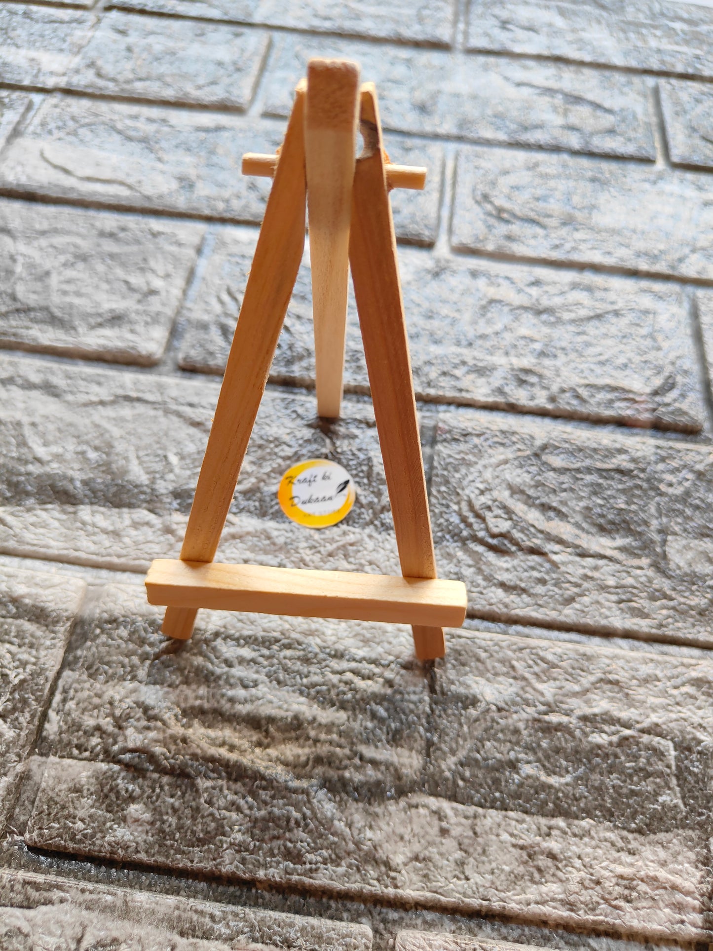 7 inch wooden easel stand on textured stone floor by Kraft ki Dukaan