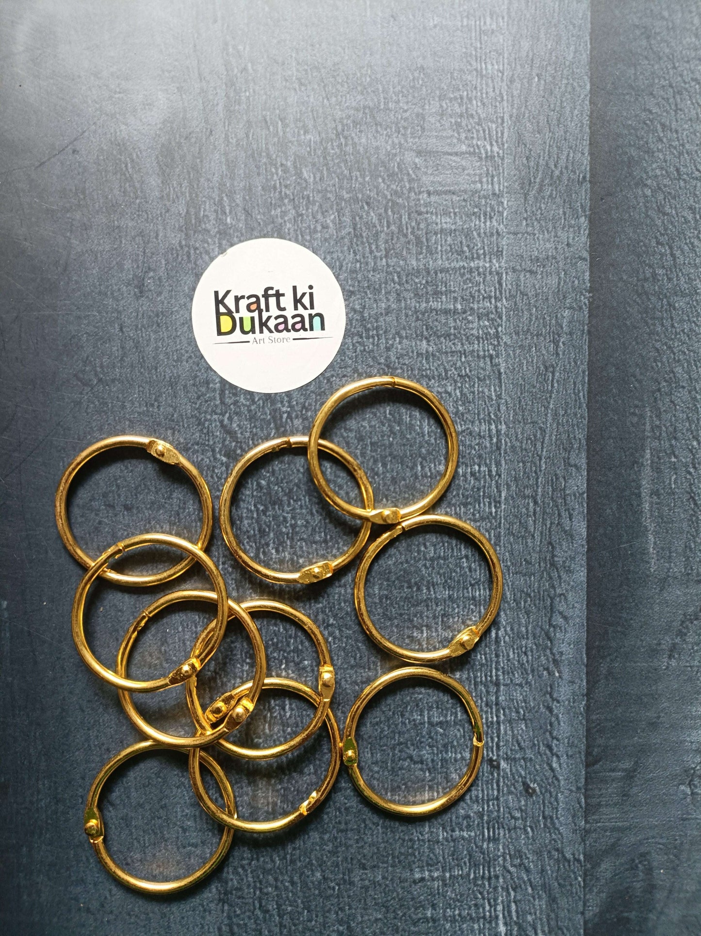 Golden book rings set of 10, close-up of round rings with ridged texture