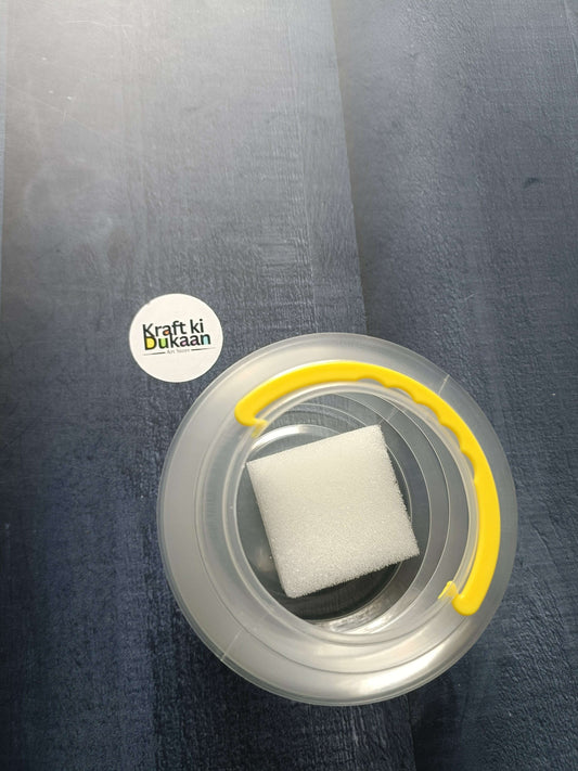 Paint brush wash bucket with yellow handle; inner area holds a white cleaning sponge.