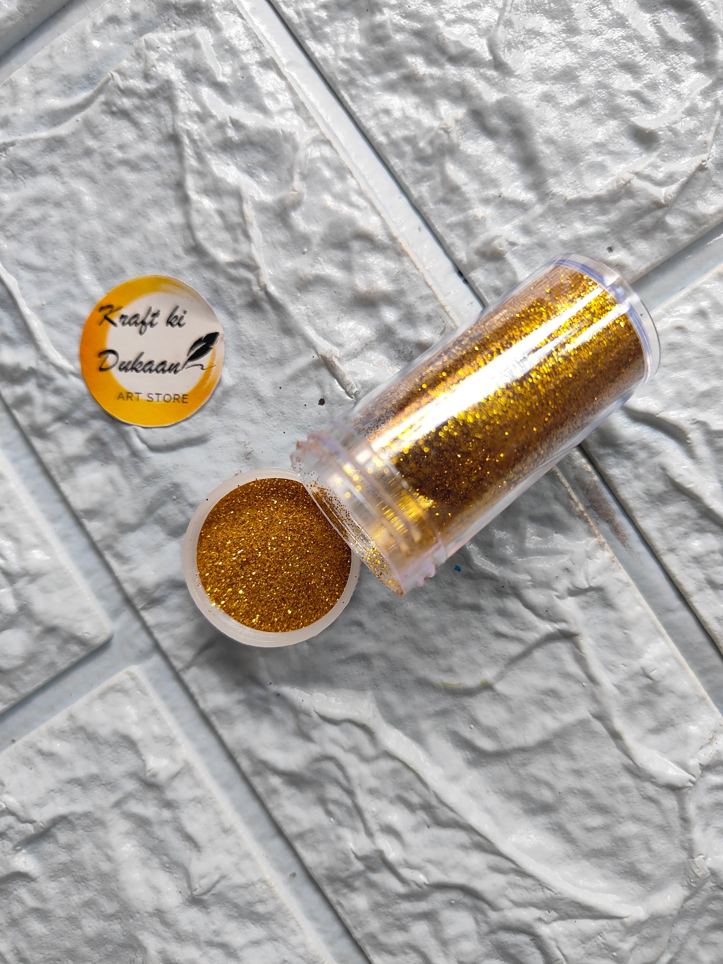 Gold chunky glitter for resin art in a clear container, perfect for crafting and decoration