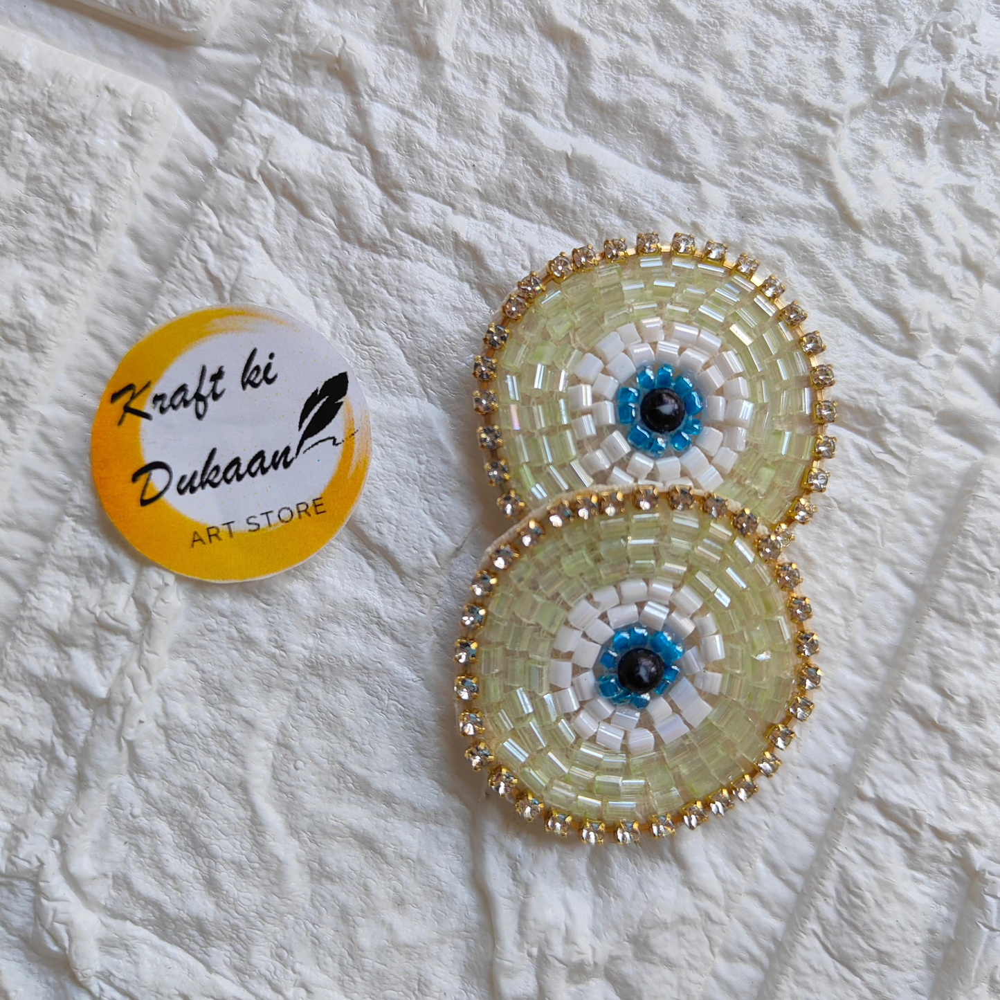 Evil eye embroidered patches with intricate beadwork in yellow and blue from Kraft ki Dukaan