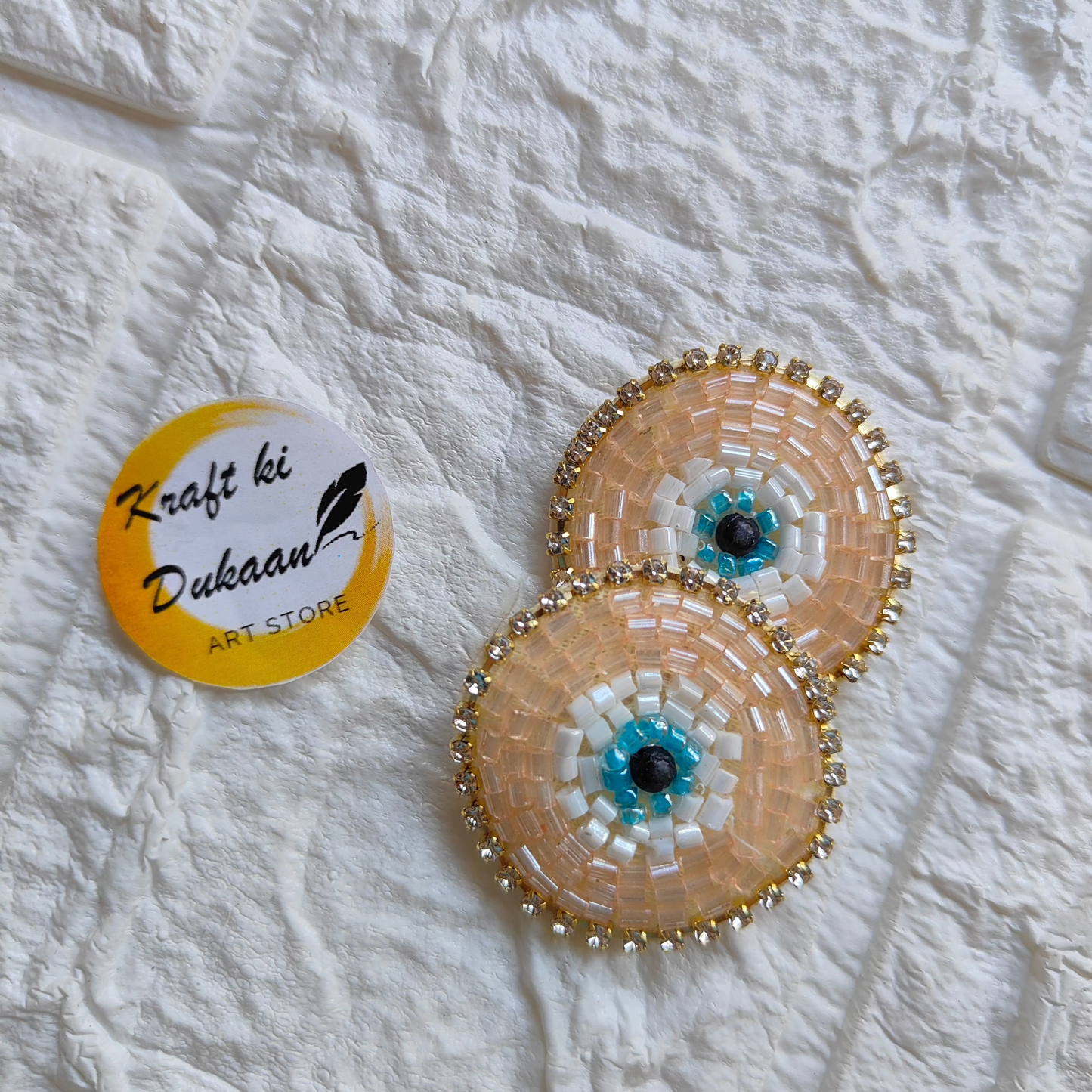 Set of two evil eye embroidered patches with colorful bead accents for decorative use