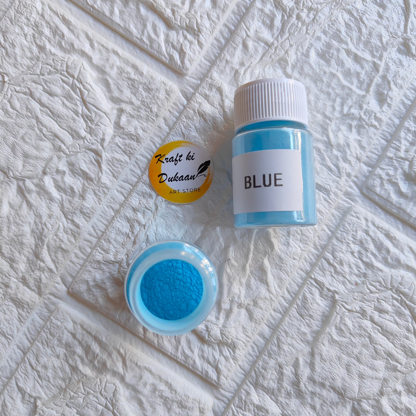 Kraft ki Dukaan blue glow mica powder for resin in a small jar and container for crafting