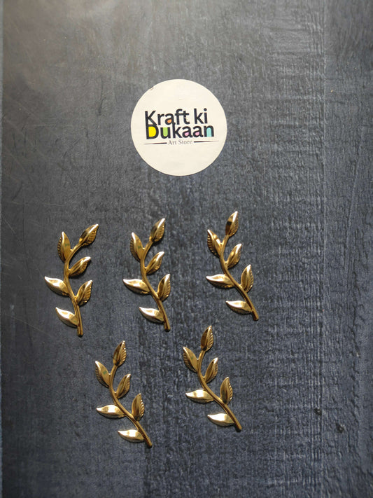 Set of gold metal leaf sprig embellishments with pointed leaves, 5 visible pieces