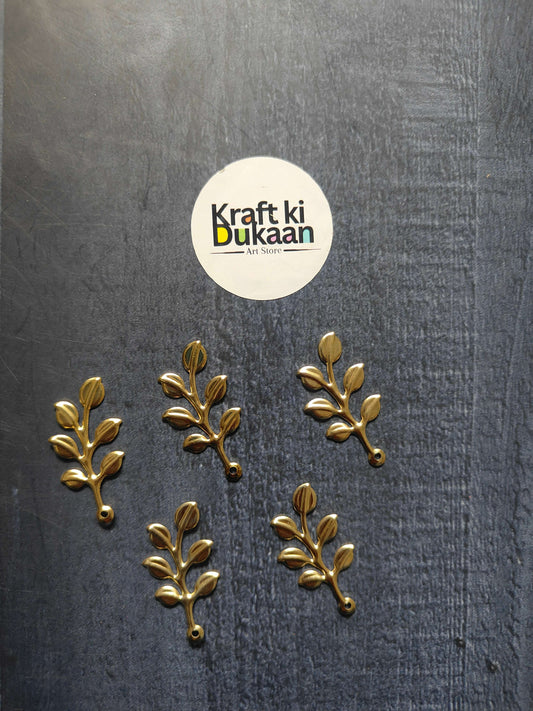 Metal leaf A17 gold sprig embellishments, multiple branches with oval leaves on fabric