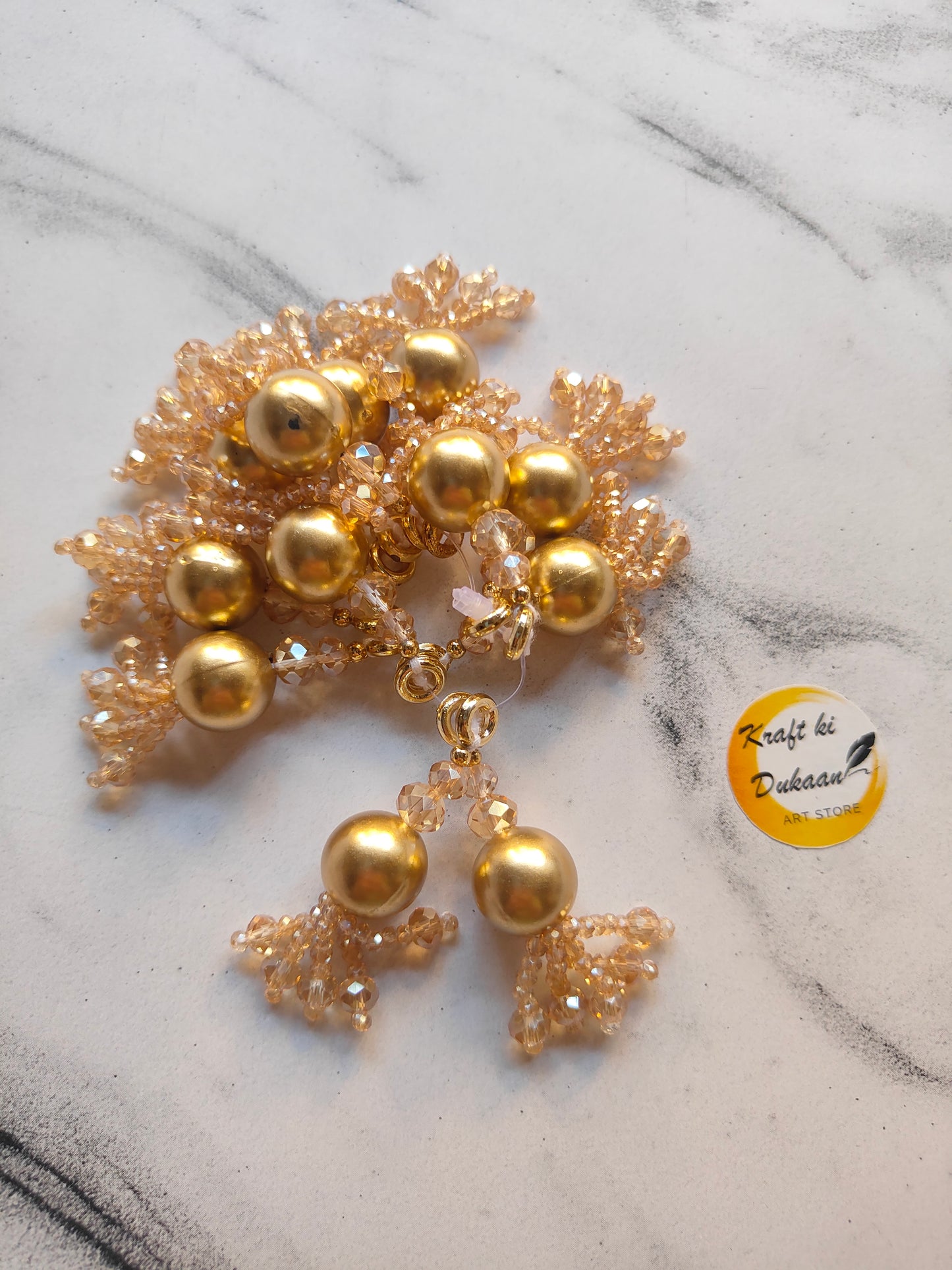 Beautiful golden latkan set for jewelry making featuring bead and lace details