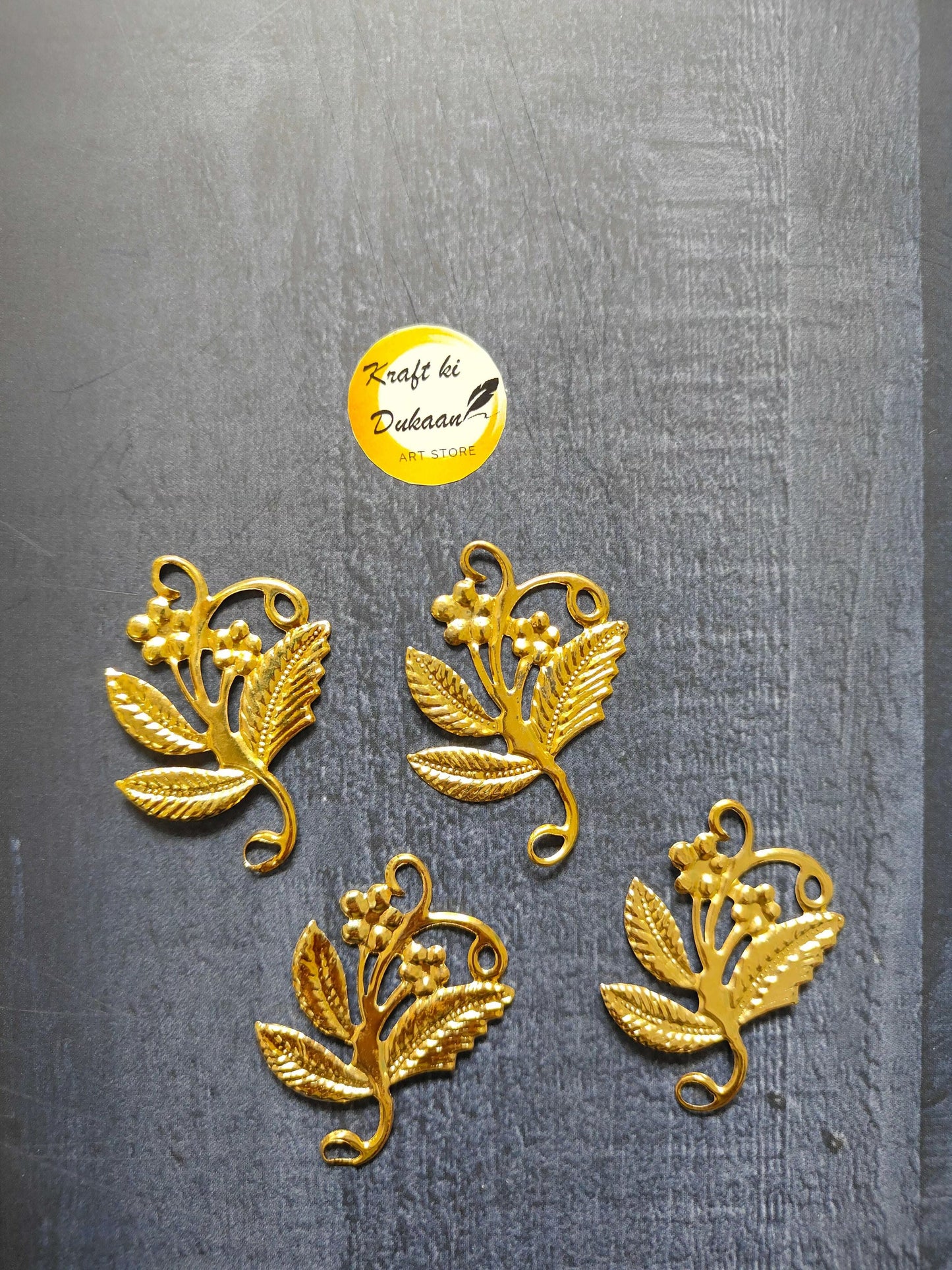 Metal Leaf A11 pack of 50—gold metal leaf charms, four pieces shown