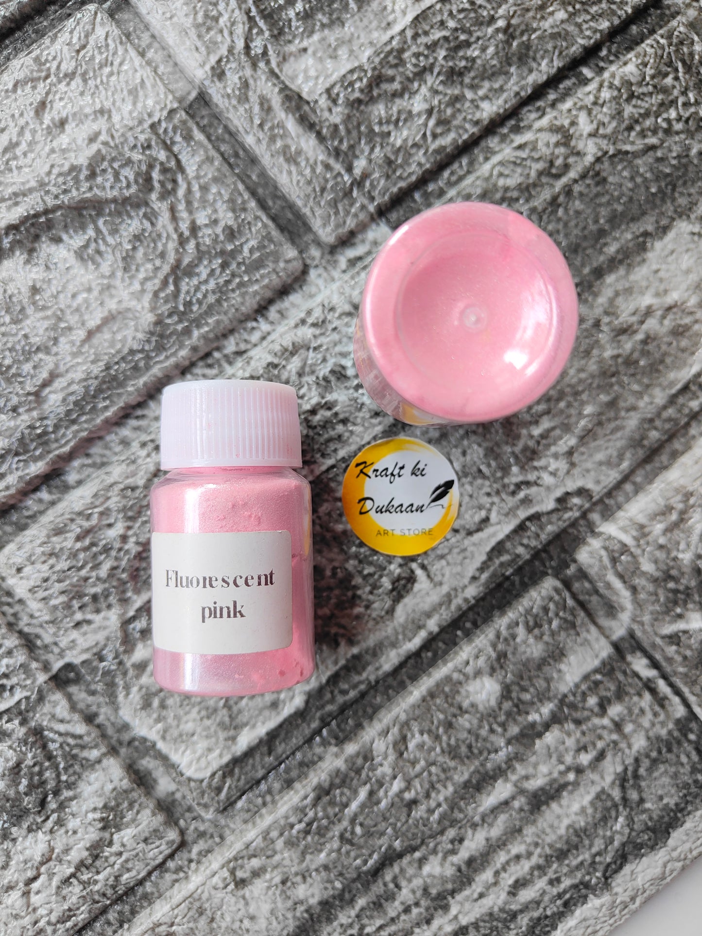 Fluorescent pink mica powder for resin art in a small jar from Kraft ki Dukaan