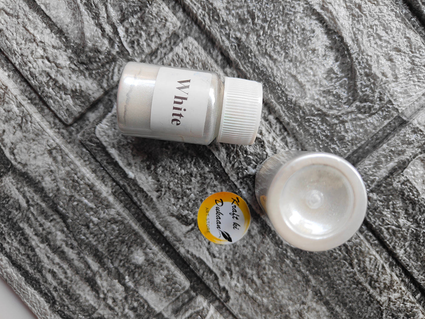 White mica powder for resin art in a clear bottle, perfect for adding shimmer to projects
