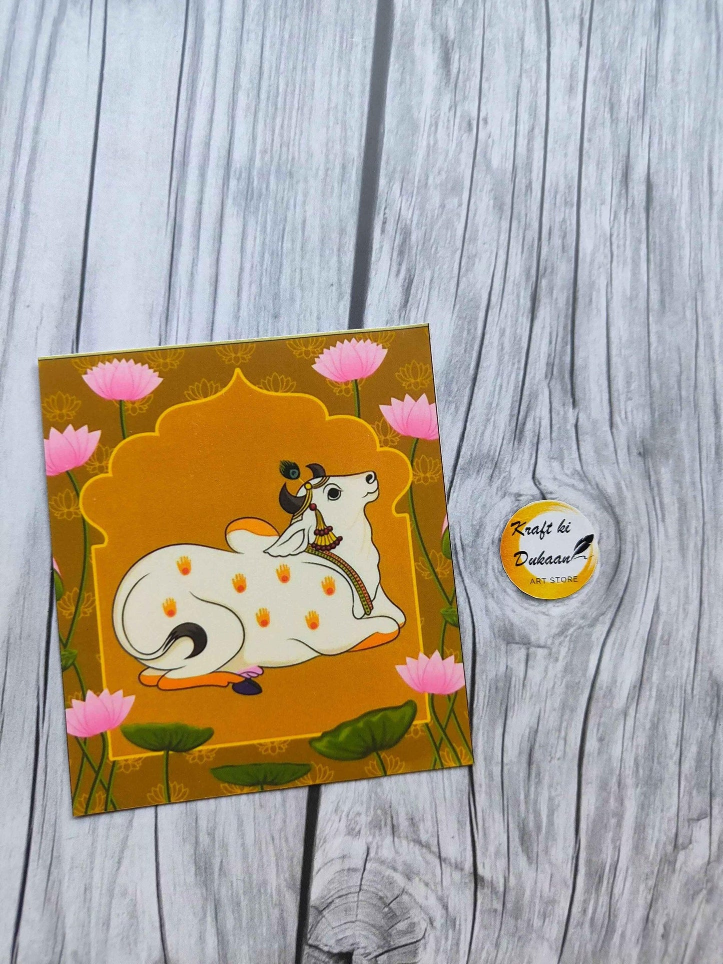 Cute cow illustrated mini sticker sheet with pink lotus flowers, orange background