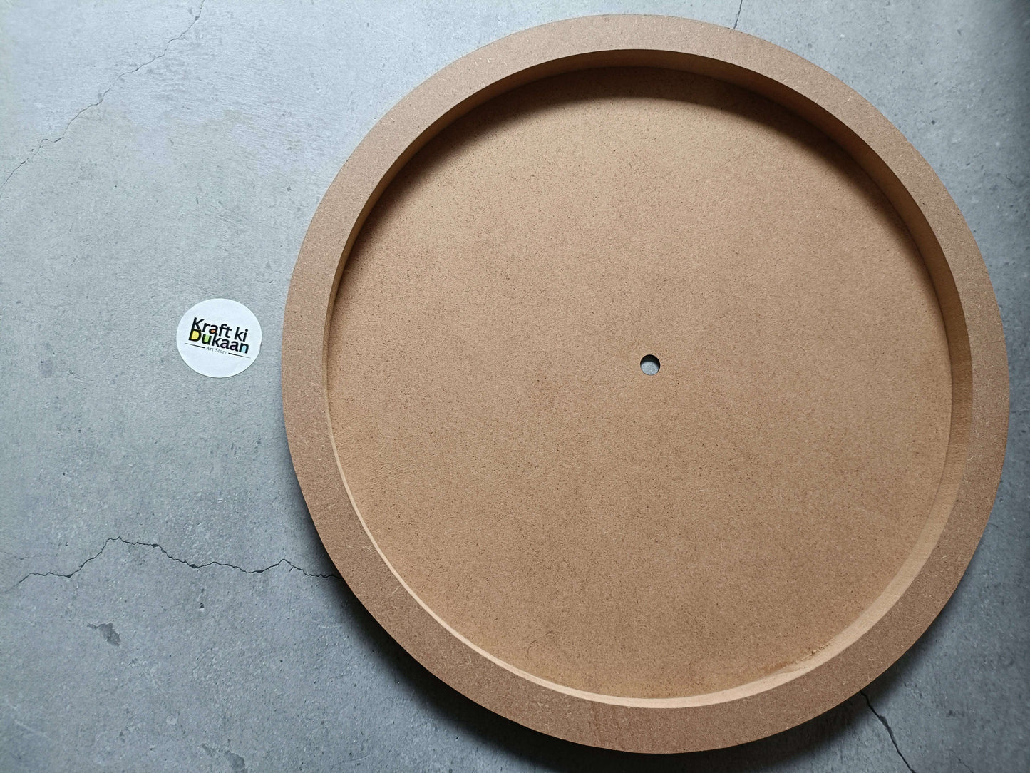 Round MDF wall mural with wide outer ring and center hanging hole, kraft brown