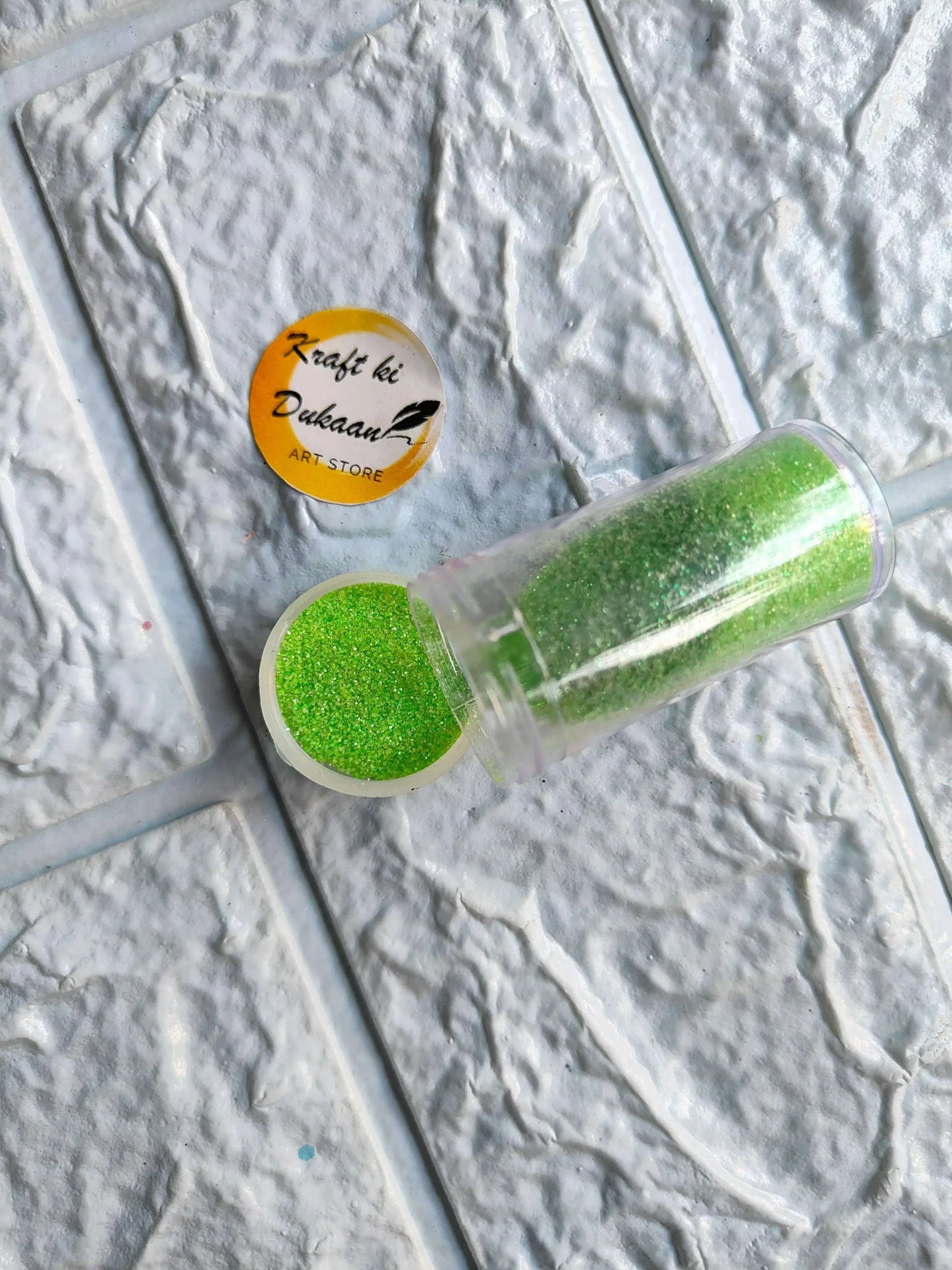 Neon glitter tube in green with matching round glitter cap