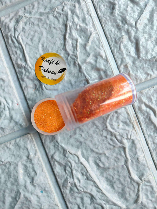 Neon Glitters mini bottle in Orange glitter, cap off