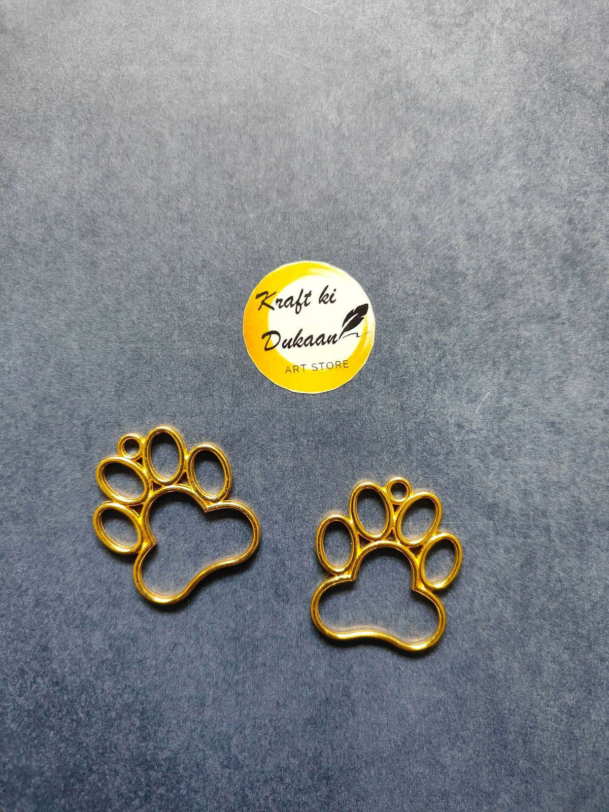 Gold paw bezel pendant with round bezel paw print, single charm