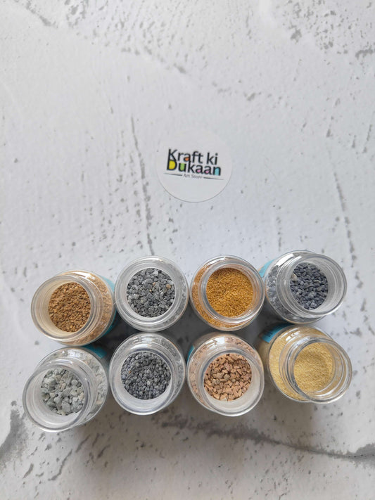 Colored sand granules pack of 8—top view of open jars with gray and tan granules