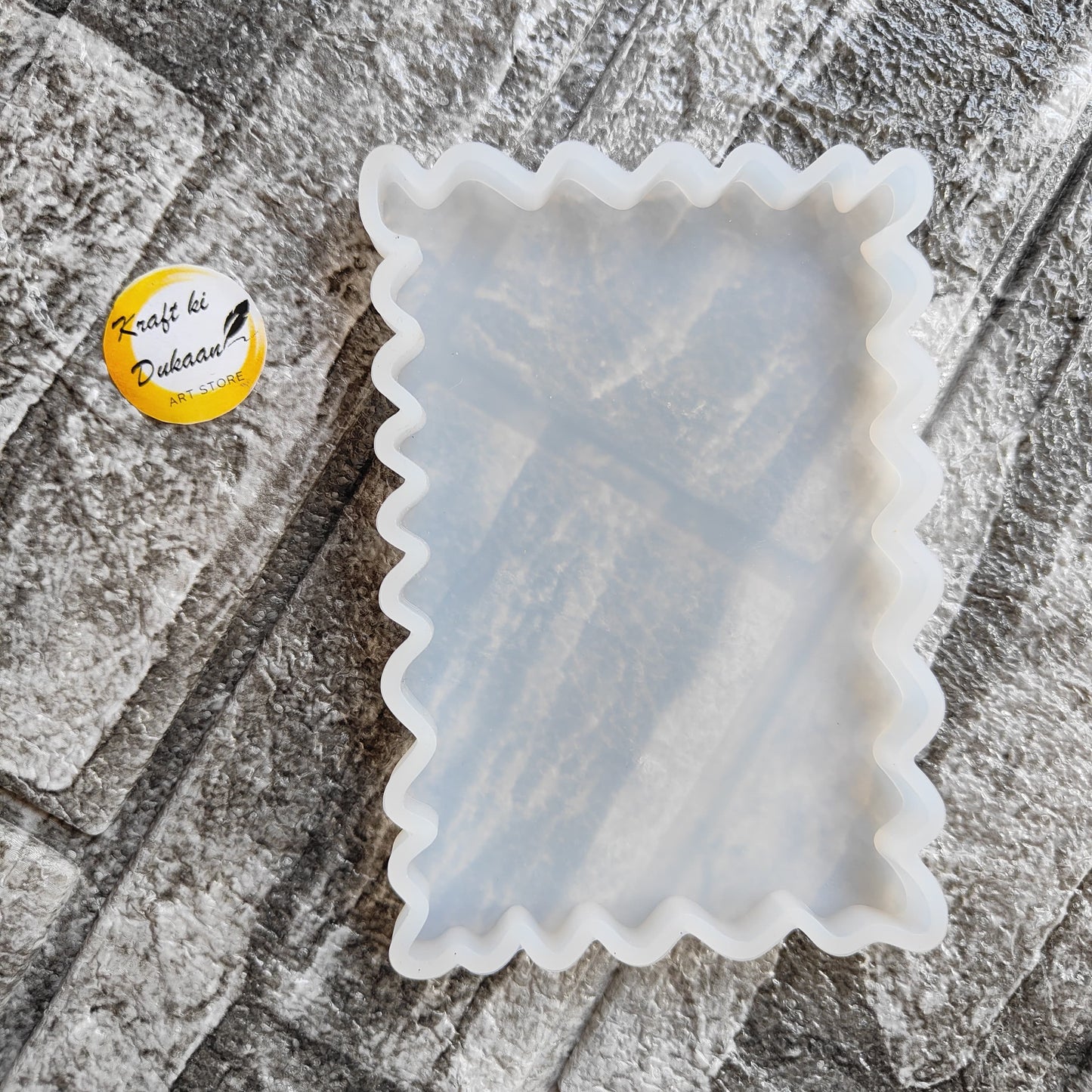 White silicone tray mould with scalloped edges for baking and crafting projects