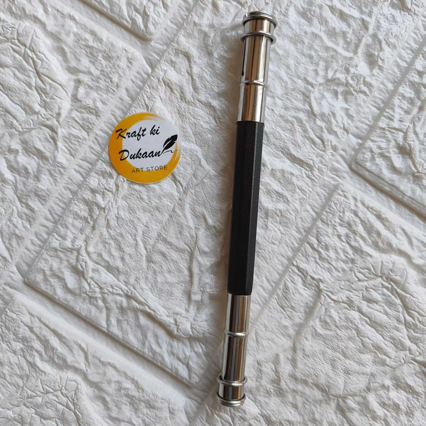 Pencil Extender A with black grip and chrome metal ends