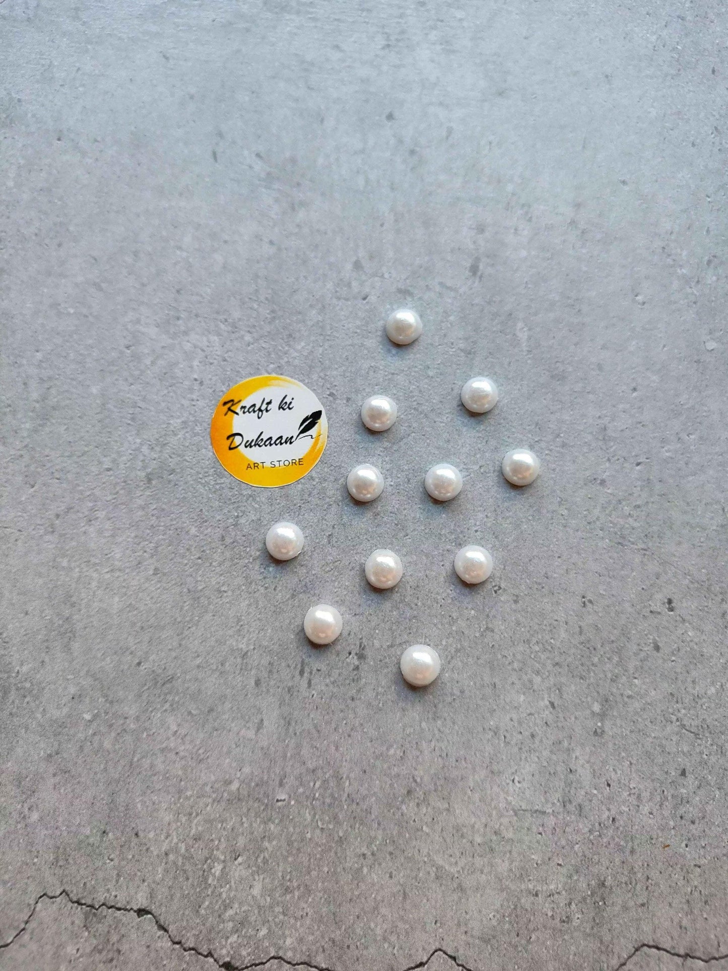 Kraft ki Dukaan white pearl half-cut round beads, scattered
