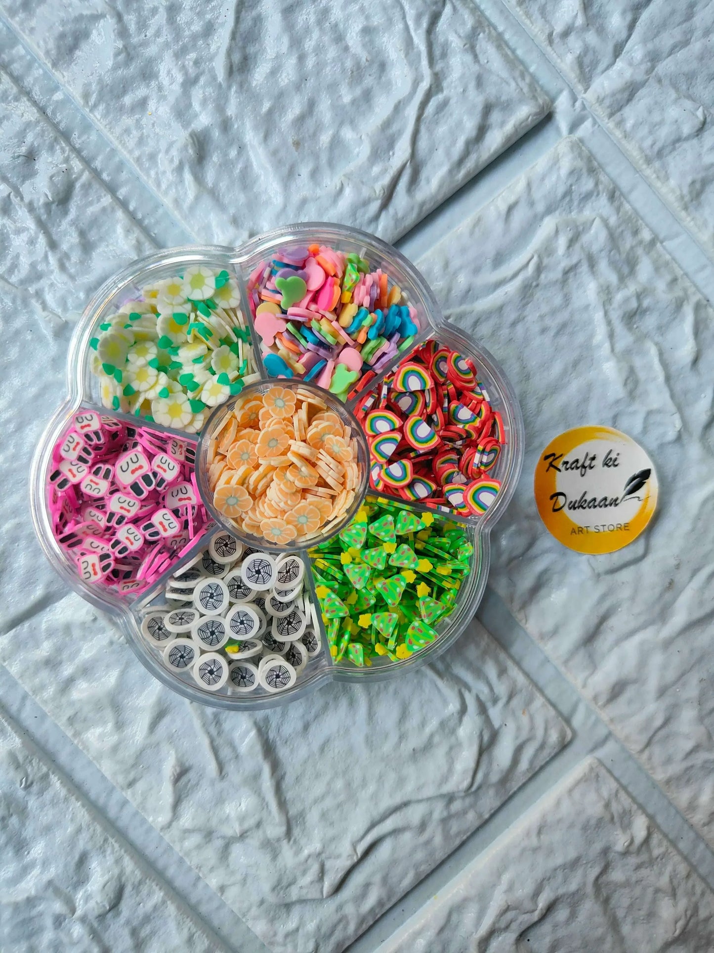 DIY shakers charms box with multiple compartments of colorful charms and beads