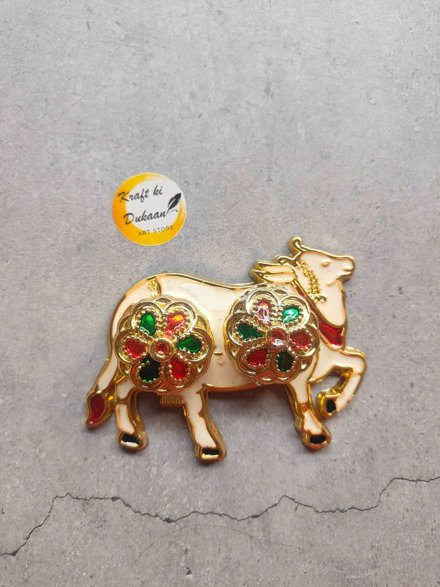 Roli Chawal Plate A4 with ornate gold cow design and colorful gem accents