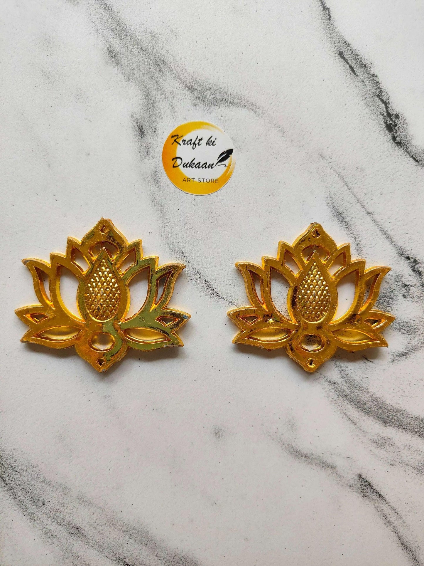 Two lotus design beads in gold-tone, textured center and petal details