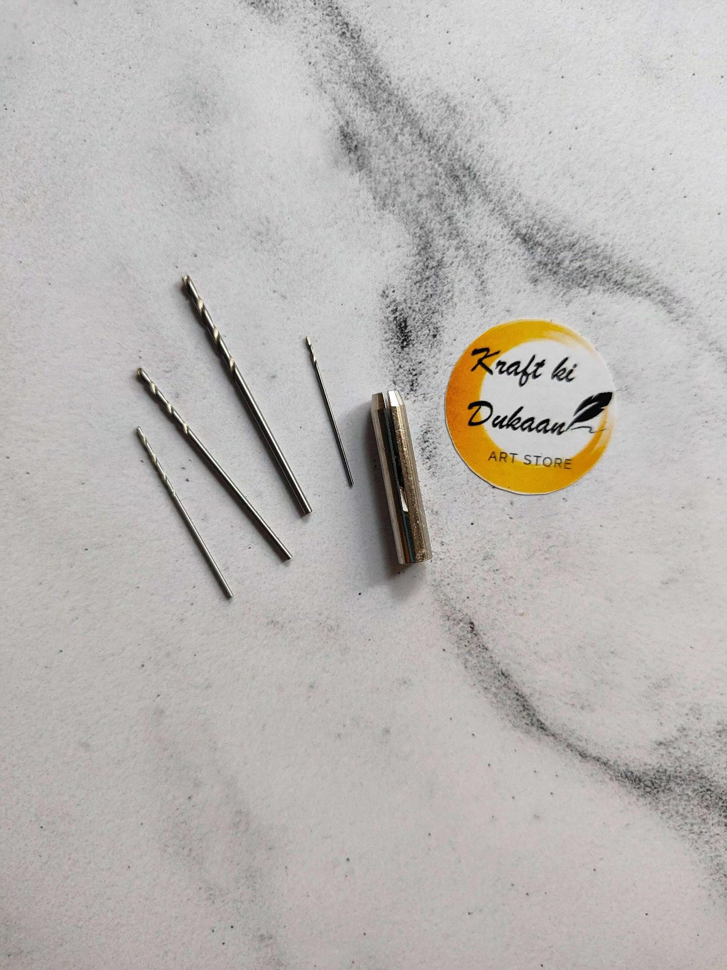 Drill bit set with metal bits and one spare metal drill sleeve