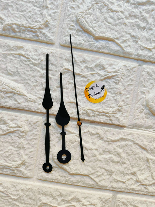 Metal clock hands set in black with three arrow tips and round mounting bases
