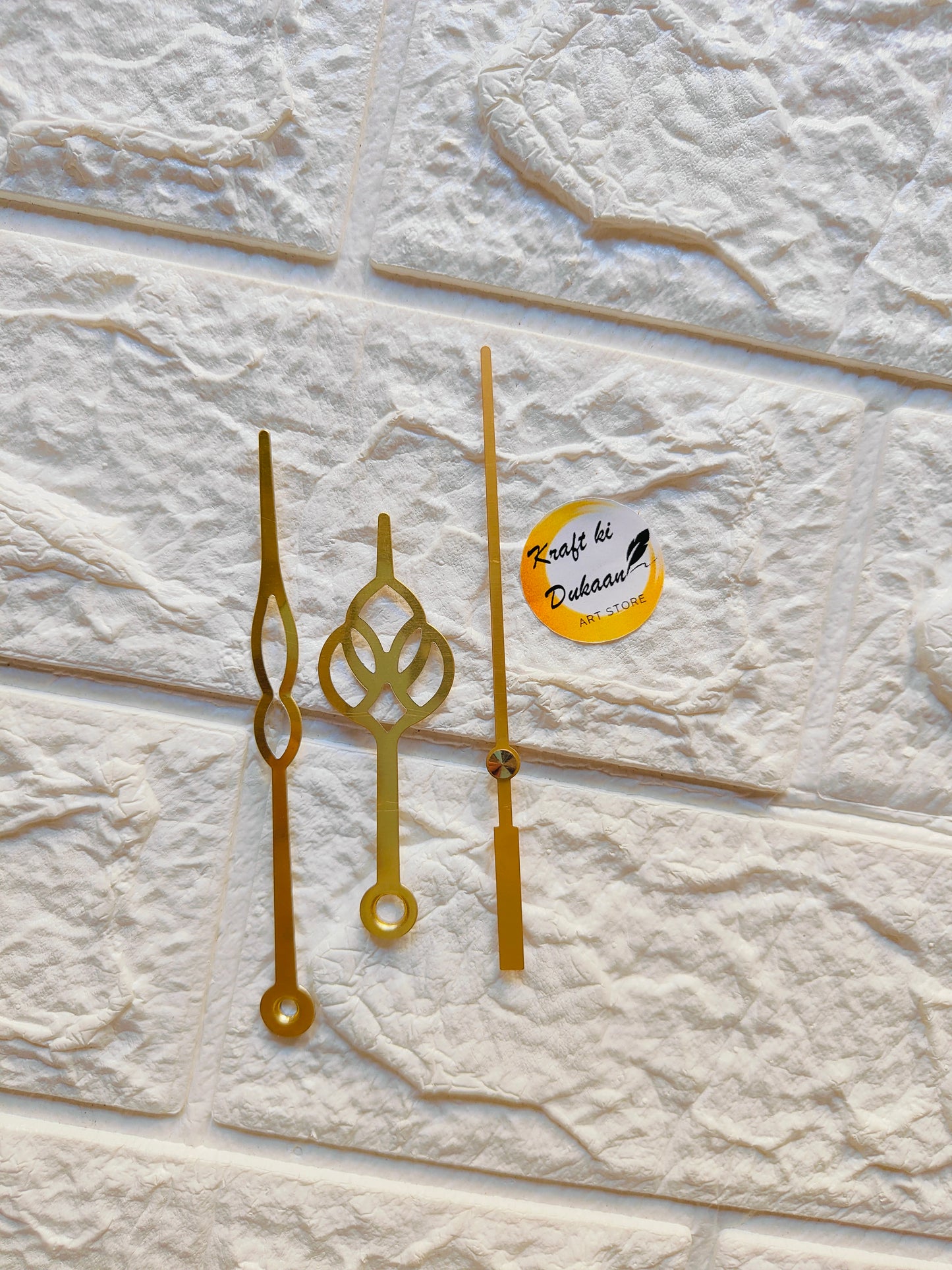 Three decorative metal clock hands for crafts in gold finish from Kraft ki Dukaan