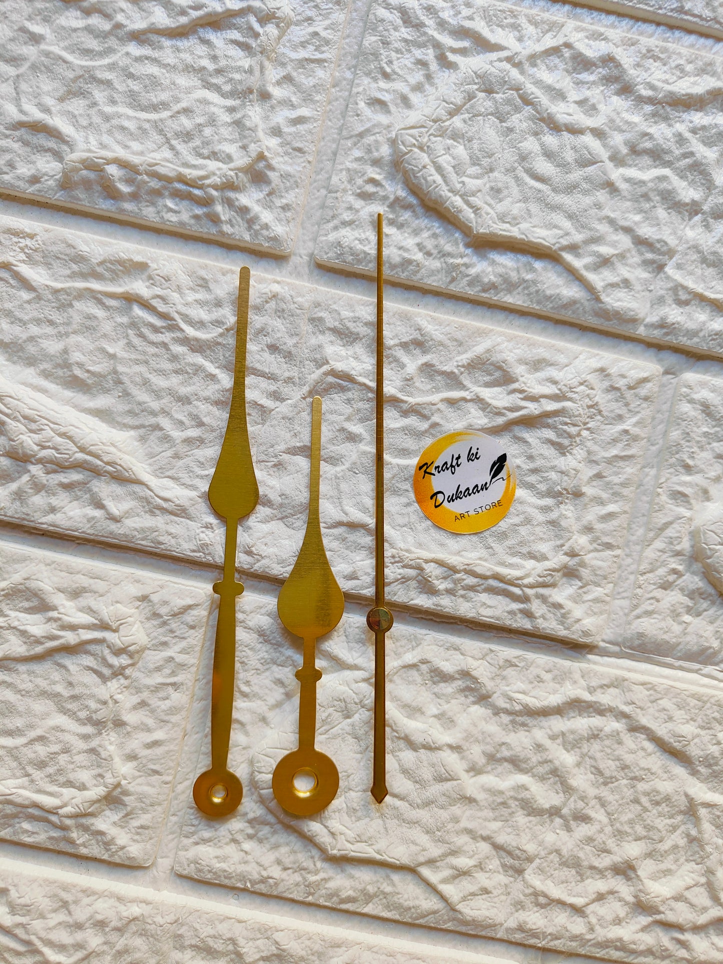 Set of yellow metal clock hands for crafts, perfect for DIY clock-making projects