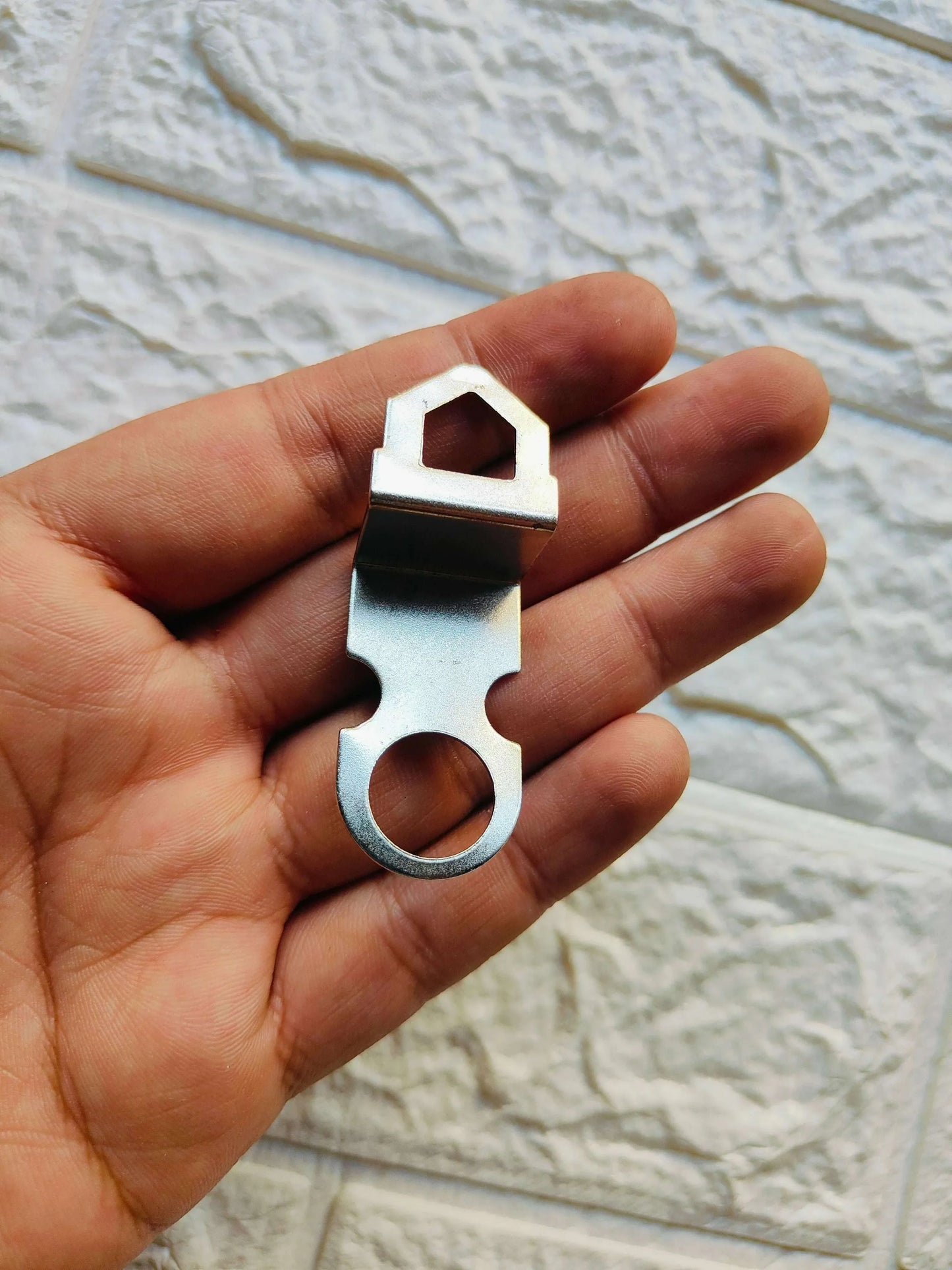 Metal Hook A1 close-up: silver metal hook with circular opening and rectangular mounting slot