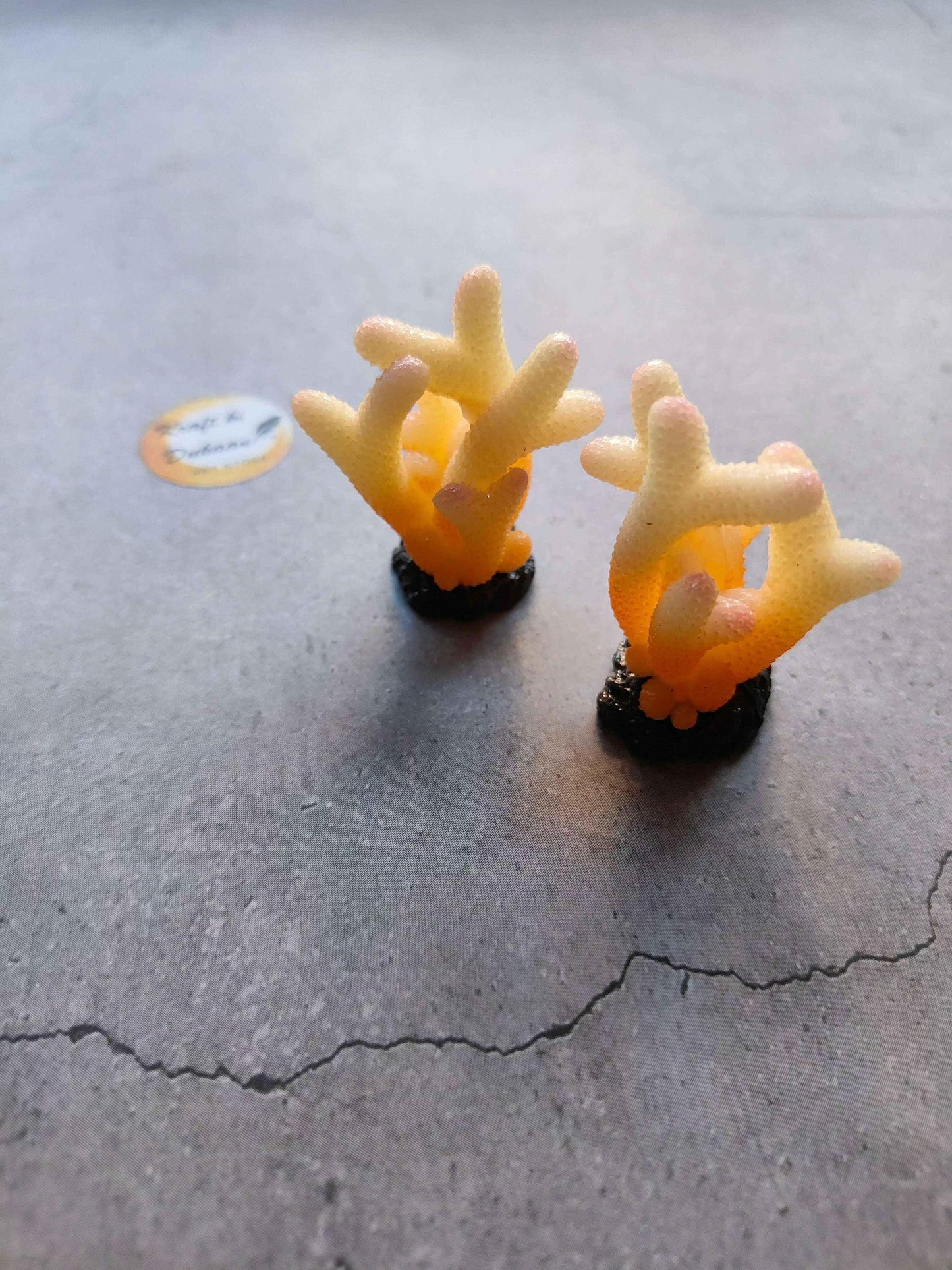 Miniature Model A25: two orange coral-like figures on dark bases